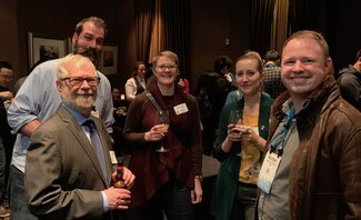 SESE Department Head Bob Rauber visiting with alumni.